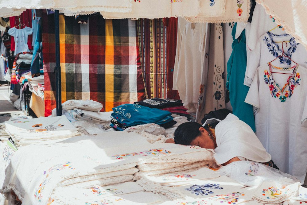 Handwoven textiles at an Andean market stall